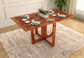 Bring a streamlined style to your space with this collapsible dining table that doubles as console table. Buy Paul Foldable Dining Table Honey Finish Online In India Wooden Street