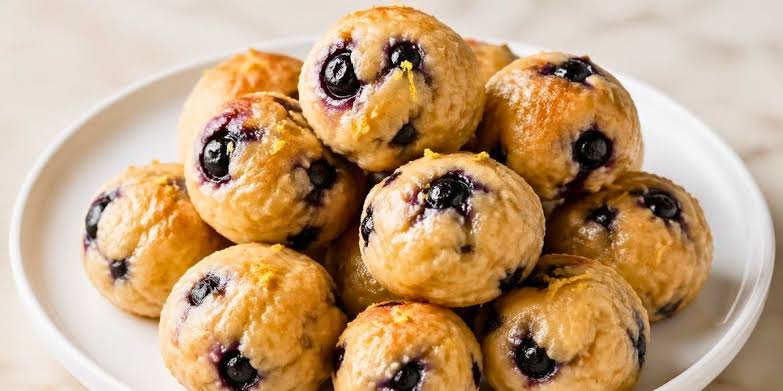 Tangy lemon blueberry cottage cheese protein bites, AI generated