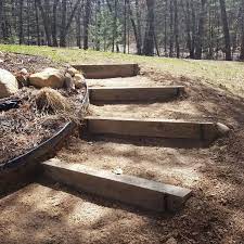 Diy Garden Steps In A Hillside Using 6x6 Timbers Flower Bed On One Side Lawn On The Other The Steps Hug The Curv Diy Garden Steps Garden Steps Garden Stairs