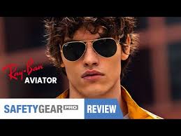 Beautiful blond woman in white dress and sunglasses at beach. Safety Gear Pro Ray Ban Aviator Sunglasses Styles