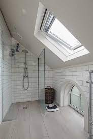 Interior designer, erin gates punched up this space with different designs. En Suite Bathroom With Sloping Ceiling Ensuitebathroom Small Attic Bathroom Sloped Ceiling Bathroom Loft Bathroom