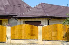 Check out results for your search Brick House With Corrugated Metal Profile Roof And Wooden Fence Stock Photo Picture And Royalty Free Image Image 84489663