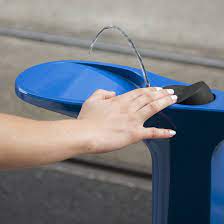 A stream of water is coming from the hydrant into a bucket. Reimagined Fire Hydrant Doubles Up As A Water Fountain For People And Dogs