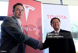 Tesla Motors CEO Elon Musk and Toyota CEO Akio Toyoda shake hands... News  Photo - Getty Images