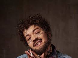 Rita Ora has a beard and face tattoos as she dresses up as Post Malone for  Halloween and fans don't even recognise her