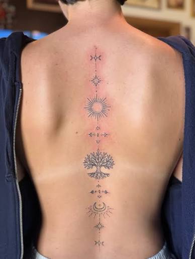 Killed it with this full celestial spine tattoo today 🌞🌙🌿✨