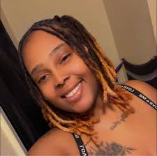 Homeless woman in front of E.C. Glass memorial