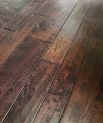 Made from layers of real wood compressed together, engineered hardwood floors are better able to handle changes in moisture and humidity than solid hardwood. Engineered Hardwood Classic Width American Walnut Collection Carrera American Wal Engineered Hardwood Flooring Engineered Hardwood Wood Floors Wide Plank