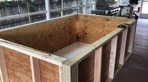 Place the submersible pump into the pond, and add water one time with a garden hose. Diy Plywood Koi Pond Build Part 1 Youtube