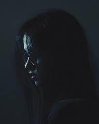 Mysterious woman in the dark with blue light | Premium AI-generated image