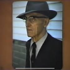 An unidentified photographer of long ago captured these Gas City men as  they gathered to share a drink at the William Lewis Tavern, an  establishment that was located