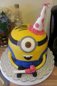 Slice the top with a serrated knife to make more of a head shape. 5 Layer Minion Cake Buttercream Frosting And Fondant Details Party Hat Made From Gumpaste Cakecentral Com
