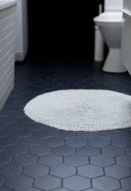 Remove old tiles and prep subfloor. Undir Sud Badid Grey Bathroom Floor Black Floor Tiles Traditional Bathroom