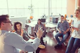Young Business Team At A Meeting At Modern Office Building By Dotshock Group Of A Young Business People Discussing Business P Fotosessiya Komanda Mechty Portret