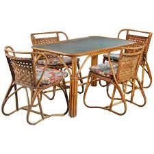 For Sale On 1stdibs The Set Comprised Of Four Woven Back Rattan Chairs With A Matching Used Outdoor Furniture Outdoor Wicker Furniture Modern Dining Room Set