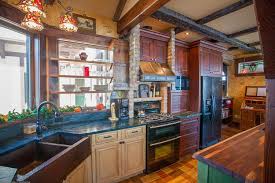 The cabinets are painted a classic soft teal, with a small antique gas oven instead of a large modern stove. Home Remodeling And Cabinetry Ideas For Semi Open Floor Plans Degnan Design Build Remodel