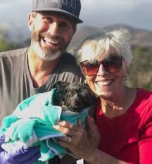 Poor pup looks a complete mess after being rescued from 30ft well by  firefighter