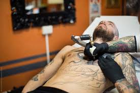 Even if the risk of infection is essentially over, the need for. Making Tattoo A Man Continue His Work In Progress Tattoo On His Chest By Jean Claude Manfredi