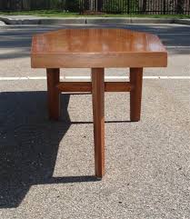 This coffee table comes with all the filters your fish might need and it will not even be disturbed that they're living in a coffee table. Nakashima For Widdicomb Coffin Shaped Coffee Table At 1stdibs