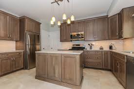 Cabinets city is a cabinets store and the premier supplier of affordable yet quality cabinetry from the top manufacturers in the country. Bianco Drift Quartz By Ceasarstone Cherry Cabinets By Omega With A Stain Color Called Pumice Kitchen Remodel Professional Kitchen Design Staining Cabinets