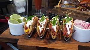 In a large mixing bowl, combine the tequila, cumin, garlic, lime juice and some salt. Fish Tacos Picture Of Guy Fieri S Vegas Kitchen Las Vegas Tripadvisor