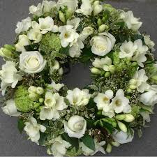 Someone has died, so their friends and family all give them something that will die too. Funeral Flowers Wreath Kensington Flowers