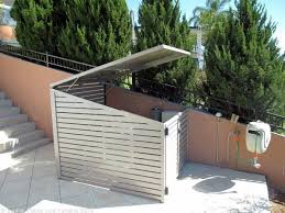 Timber slat wall hides pool pumps and equipment, a vertical wall and pool seating/storage units. Top 40 Best Pool Equipment Cover Ideas Concealed Designs