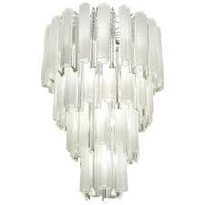 Great for dining rooms, kitchens or any space that needs a practical light fixture, each provides a bright glow and is available in a wide array of designs. Venini 1960s Cylinder Crystal And White Murano Glass Round Chandelier On Nickel For Sale At 1stdibs