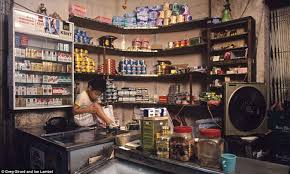 A Child With A Grazed Knee Sits On A Counter Top In A Tiny Shop Which Sells Essentials Like Toilet Paper And Canned Foo Kowloon Walled City Walled City Kowloon