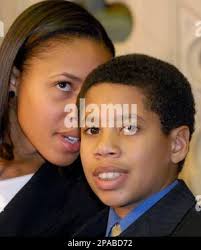 New York Gov. David Paterson's stepdaughter Ashley Dennis, left, talks with  her half-brother Alex Paterson as Gov. Paterson is sworn in by Chief Judge  Judith Kaye in the Assembly Chamber at the state Capitol in Albany, N.Y.,  Monday, March 17, 2008. (AP ...