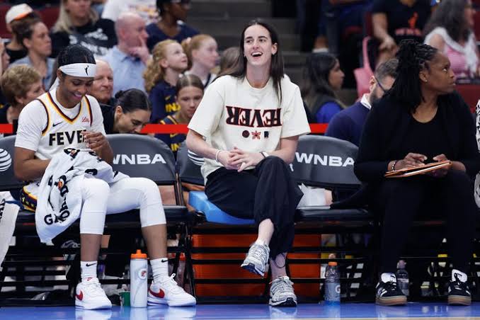 Caitlin Clark may be out with injury but she's plenty active on sidelines