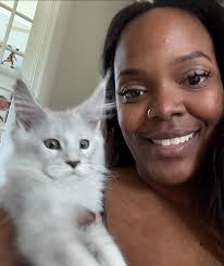 Cute bunny sitting up in the snow in Hudson, NH