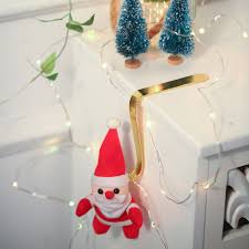Hanging a garland above your fireplace mantle and stockings gives your home a warm and festive look during the holidays, but damaging your home with nails leaves a terrible view for the rest of the year. Metal Christmas Stocking Holder Xmas Fireplace Hanger Hook Gold Mantle Garland Clip For Christmas Xmas Party Decoration 8 Pack