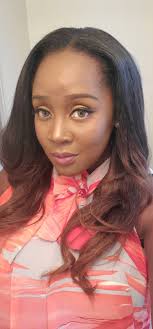 Not a staged photo and no tiny people were exploited to get the photo. One  person is nearer to the camera therefore looks big and the other person is  farther away and