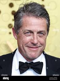 Hugh Grant arrives at Los Angeles International airport looking slightly  worse for wear following a long haul flight from London. Sporting a "bed  head" hairdo, the actor made his way to his