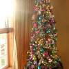 Hang homemade ornaments in prominent places where they can be easily seen, then fill in any gaps with colored ball ornaments for a cohesive look. Colorful Christmas Tree Decorating Ideas