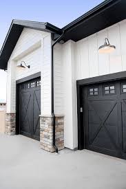 Black And White House With Wood Garage Door I Like The Steps And Paved Pathway With The Covered Porch On Our House We Couldnt Have As Big Of A Porch A Modern Farmhouse Exterior House Exterior New Homes