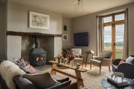 The tiled floor gives off a lustrous gray appearance that is complemented by white walls. 75 Beautiful Country Living Room Ideas Designs June 2021 Houzz Uk
