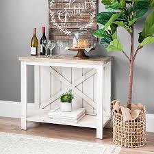 With this console table by the front door, they'll be greeted by the warm glow of a lamp, a cluster of potted greenery, or maybe even your own custom art pieces. Finley Cream Barn Door Back Console Table Kirklands