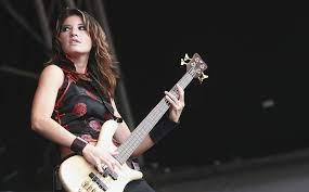She is a member of music group sick puppies (since 1997). Sick Puppies Emma Anzai Just A Rock N Roll Junkie