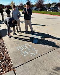Freshmen Academic Biology students decorating our sidewalk with the  molecules of life: carbohydrates, amino acids, fats, proteins, and more!  The students loved this hands-on activity and were lucky to have a sunny