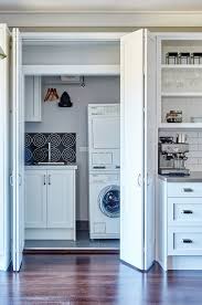 Hiding the washer and dryer becomes easy by simply shutting the closet door. Laundry Ideas How To Hide One In The Kitchen The Interiors Addict