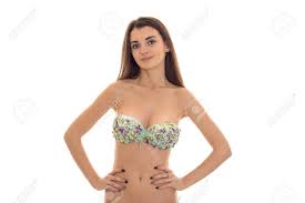 Young Beauty Brunette Woman With Big Natural Breasts In Swimsuit With  Floral Pattern Looking At The Camera Isolated On White Stock Photo, Picture  and Royalty Free Image. Image 72337319.