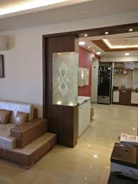 A brief design history of the humble powder room. Drawing Room And Dining Room With Wooden Glass Partition Modern Luxury Design False Ceiling Living Room Living Room Partition Living Room Designs