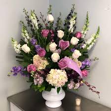 Aspidistra leaves and lily grass foliage comp. Evans Lavender White Funeral Urn In Peabody Ma Evans Flowers