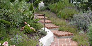 When you're landscaping a slope, you can use terraced or retaining walls, and build steps to give you access to higher levels of your garden. Hillside Landscaping How To Landscape A Slope Landscaping Network