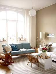 Instead, pull all of your furniture away from the walls and float a seating arrangement in the middle of the room. Vintage Modern Apartment In Germany Vintage Modern Living Room Home Living Room Living Room Decor Modern