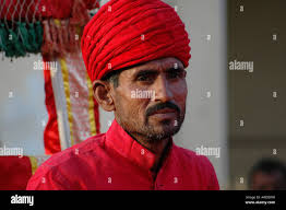 Indian male native costume turban hi-res stock photography and images