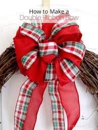 Take a long ribbon to make the bow lay the ribbon on a flat surface or floor and cut the ribbon with a scissor. How To Make A Double Ribbon Bow For A Wreath Liz On Call