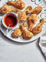 Pilons De Poulet Croustillants Au Sesame Et Sauce Epicee Au Citron Ricardo Recipe Crusted Chicken Lemon Sauce Chicken Drumsticks